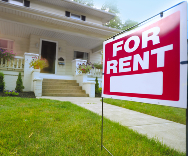 House with Signage outside of For Rent
