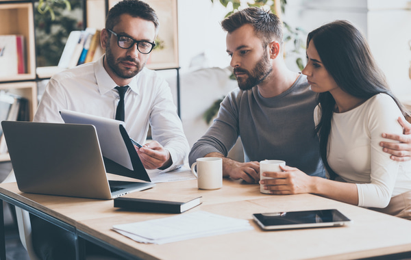 SU - Professional advicer discussing with young couples Professional advicer discussing with young couples