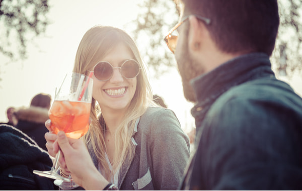Beautiful couple toasting at cafe