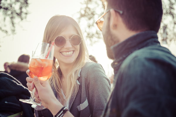 Beautiful couple toasting at cafe