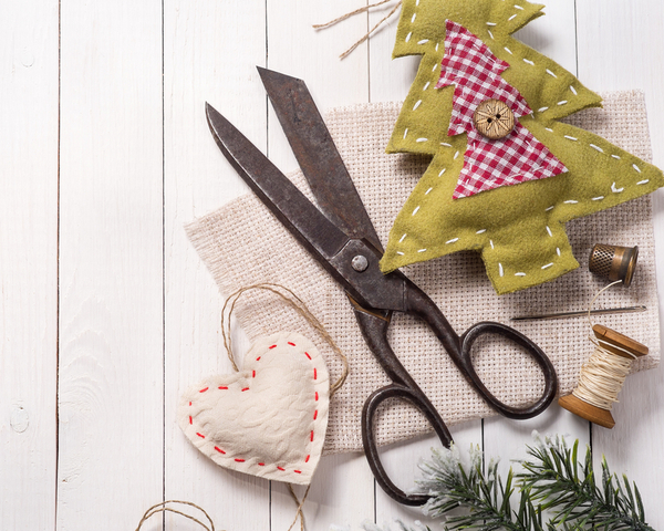 Vintage scissors surrounded by Christmas decorations