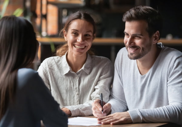Young couple consulting agent