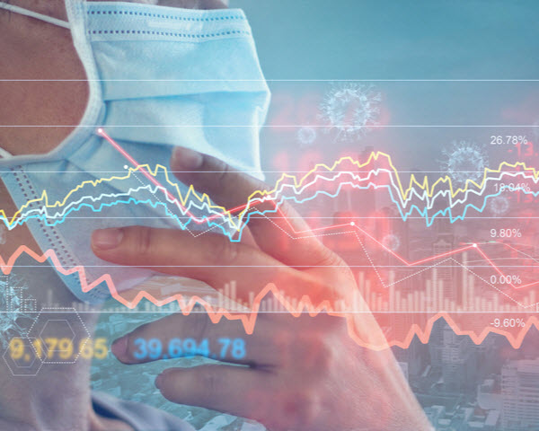 Businessman wearing face mask with financial graphs
