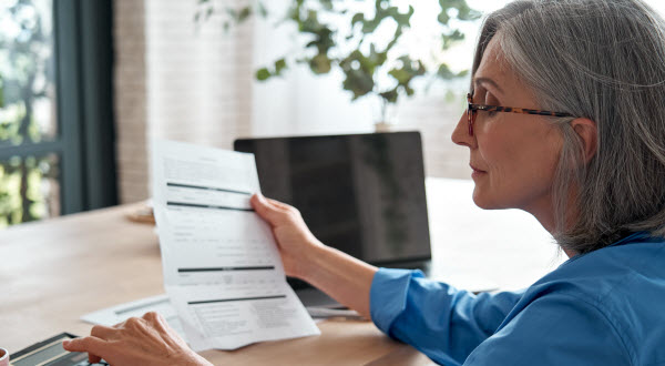 lady managing account finances, calculating money