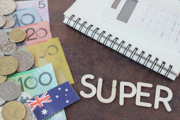 Australian money, AUD with SUPER word, calculator, and notebook