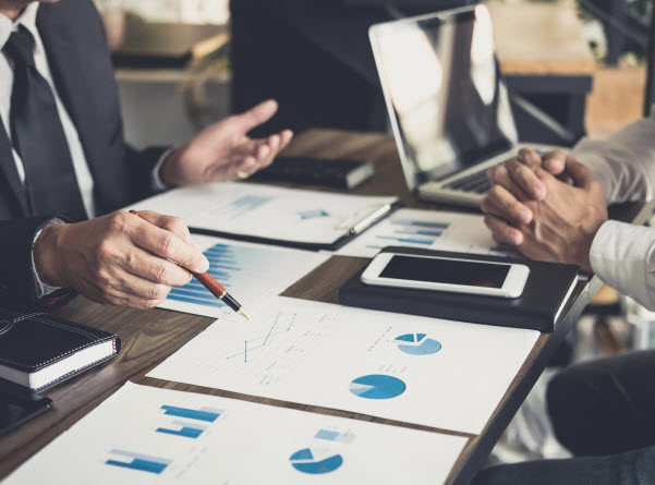 Step Up Group - High yield investments meaning colleagues discussing new plan financial graph