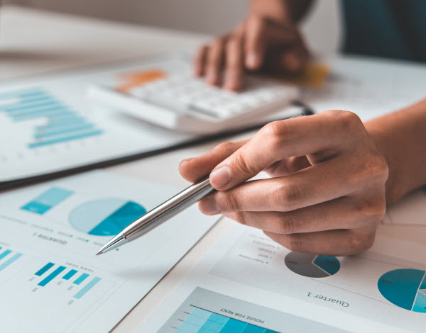 Step Up Group - Investment overview Financial businessman calculating corporate income tax data And analyzing charts of financial stocks