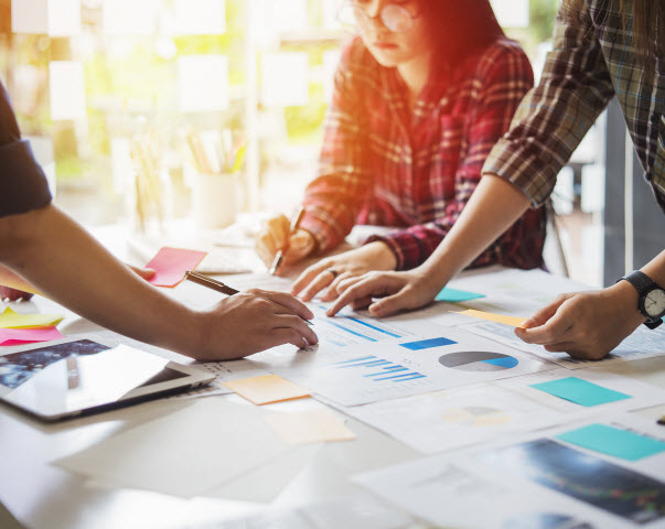 Step Up - ESG investment strategies to consider Business Team Coworker working planning with colleague in office