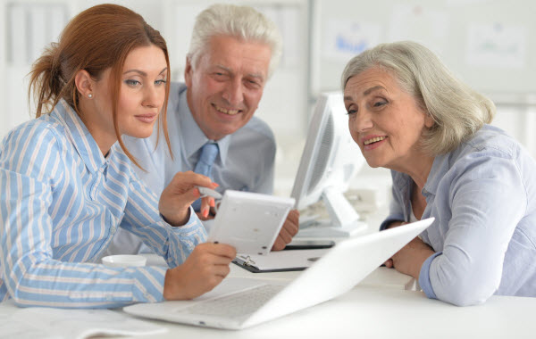 businesspeople working in modern light office