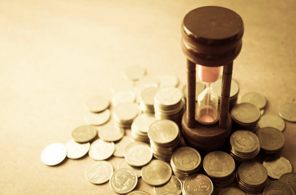 coin money and hourglass