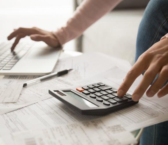 Step Up - Budget analysis woman calculating monthly expenses