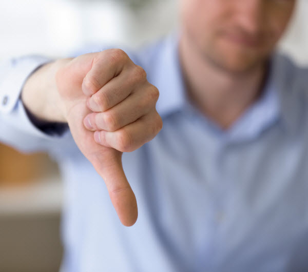 Step Up - Current market sentiment businessman with dissatisfied face showing negative sign, dislike with thumbs down