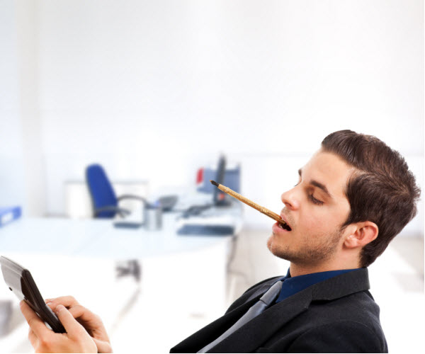 Step Up - Monitor investments regularly Businessman using a calculator while sitting on a chair in his office