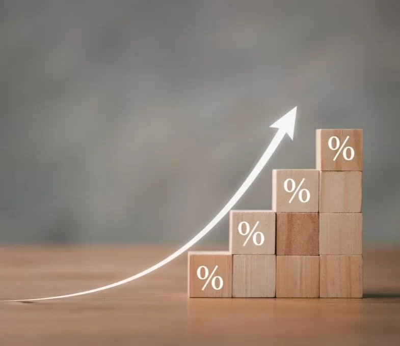Wooden blocks with Icon percentage symbol and arrow pointing up