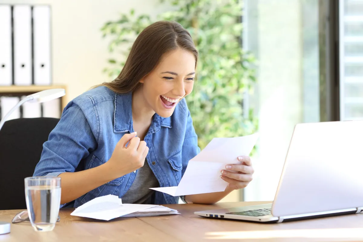 excited entrepreneur girl reading good news