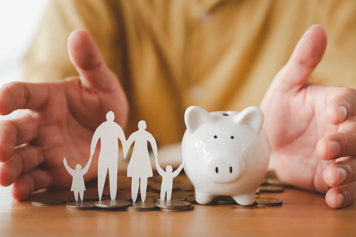 businessman take position protect on piggybank